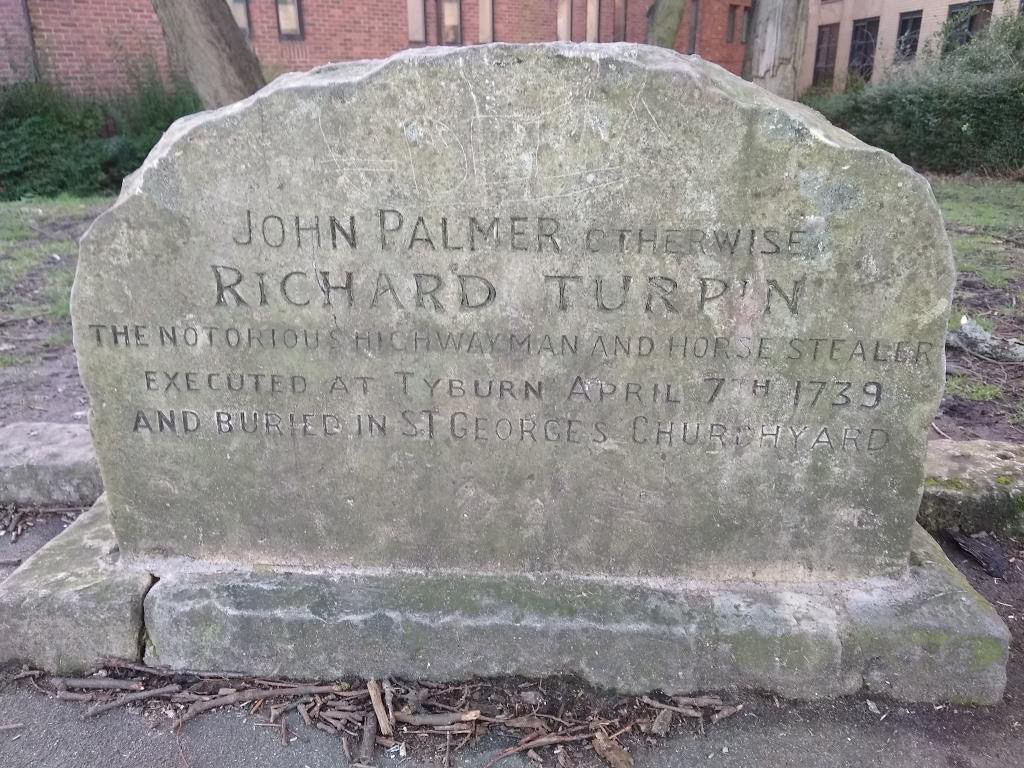 a small cracked grave stone which has carved on it John Palmer otherwise Richard Turpin The notorious highwayman and horse stealer Executed at Tyburn April 7th 1739 and buried in St George Church Yard.
