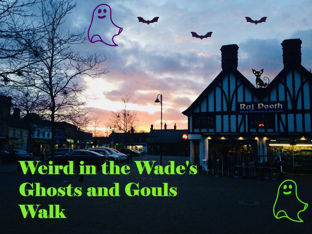 The Market House at sunset with Weird in the Wade Ghosts and Ghouls Walk written in green at the botom. Superimposed over the image are cartoon ghosts, bats and a black cat on the roof of the market house.